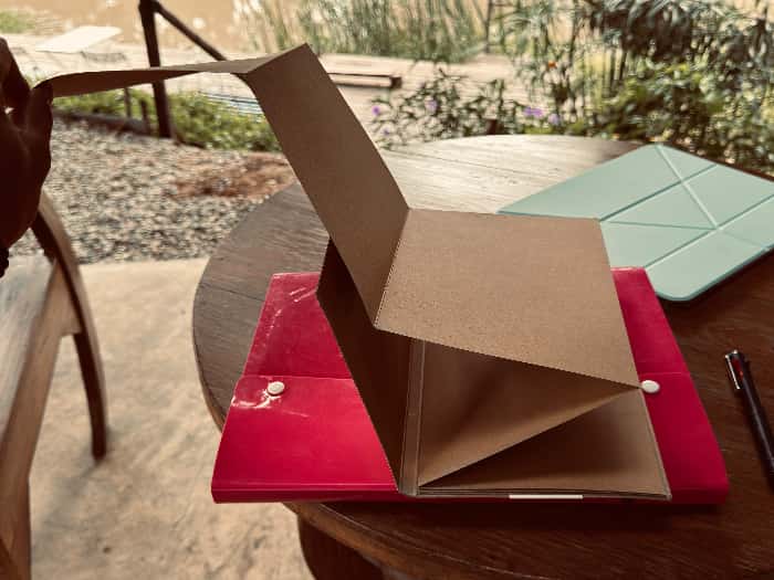 A memory book with handwritten notes and small keepsakes.